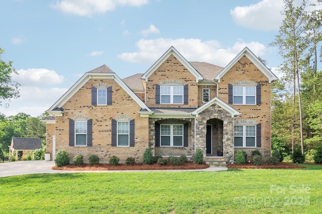 1004 Princesa Dr, Matthews, NC 28104 - craftsman inspired home with roof with shingles, a front lawn, and brick siding