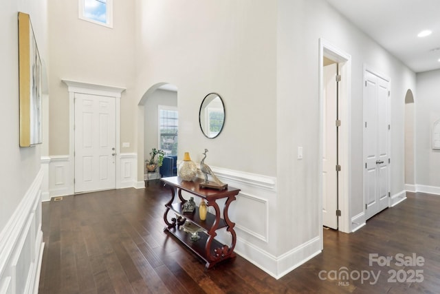 1004 Princesa Dr, Matthews, NC 28104 - hall with arched walkways, wood finished floors, and recessed lighting