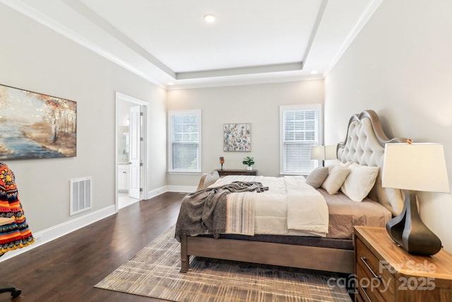 1004 Princesa Dr, Matthews, NC 28104 - bedroom with wood finished floors, a tray ceiling, baseboards, connected bathroom, and recessed lighting