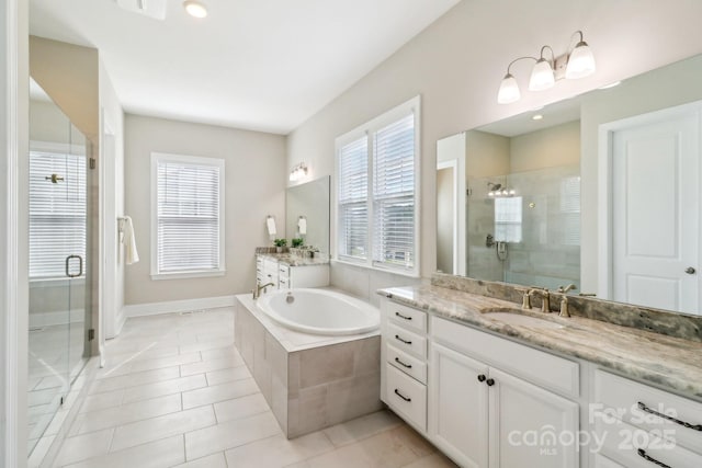 1004 Princesa Dr, Matthews, NC 28104 - full bath with vanity, a shower stall, tile patterned flooring, and plenty of natural light