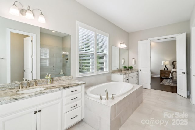 1004 Princesa Dr, Matthews, NC 28104 - full bath with a shower stall, a bath, two vanities, and ensuite bathroom