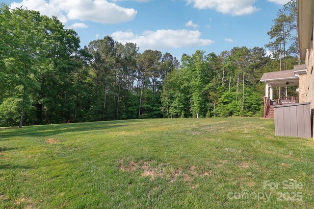 1004 Princesa Dr, Matthews, NC 28104 - view of yard with stairway and a wooded view