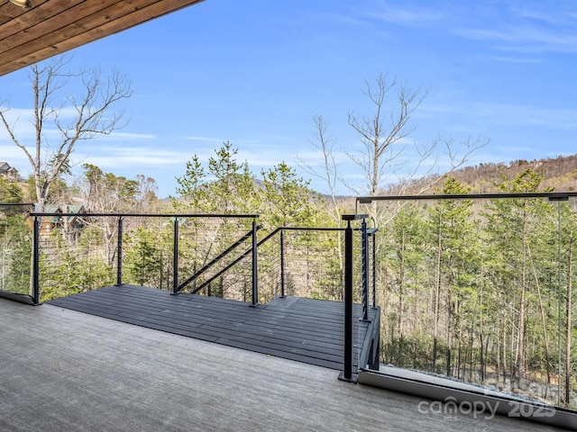 deck featuring a forest view