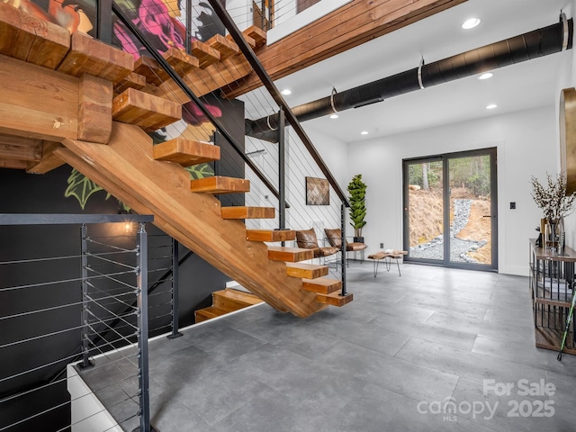 staircase featuring recessed lighting and baseboards