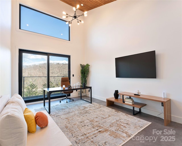 office space featuring wooden ceiling, baseboards, a notable chandelier, a high ceiling, and recessed lighting