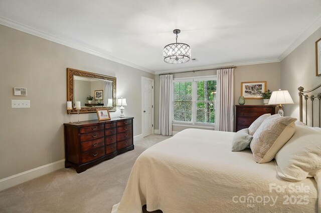 3804 Bellingham Ln, Charlotte, NC 28215 - bedroom featuring light carpet, baseboards, ornamental molding, and a chandelier
