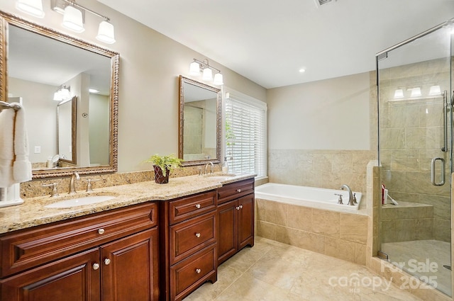 3804 Bellingham Ln, Charlotte, NC 28215 - full bathroom featuring tile patterned floors, a bath, a shower stall, and double vanity