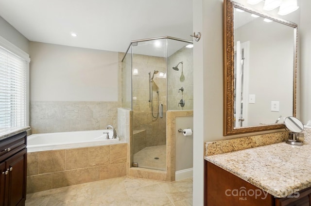 3804 Bellingham Ln, Charlotte, NC 28215 - full bathroom with a stall shower, vanity, and a garden tub