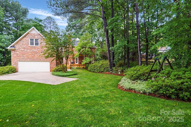 3804 Bellingham Ln, Charlotte, NC 28215 - view of grassy yard featuring an attached garage and driveway