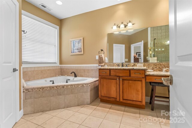 full bath featuring a garden tub, visible vents, vanity, tile patterned floors, and tiled shower