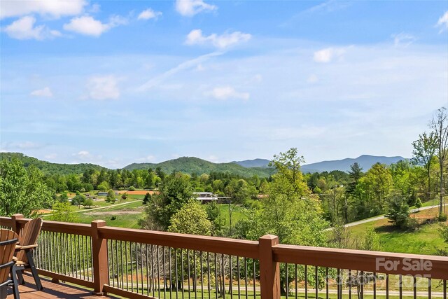 property view of mountains featuring a view of trees