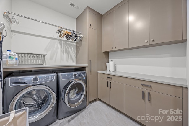 1550 High St, Charlotte, NC 28211 - laundry area featuring cabinet space, independent washer and dryer, and visible vents