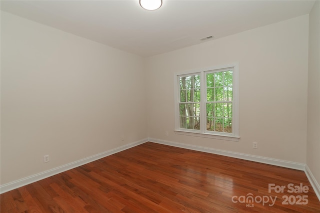 4410 Laurel Twig Ct, Charlotte, NC 28215 - empty room with baseboards, visible vents, and wood finished floors
