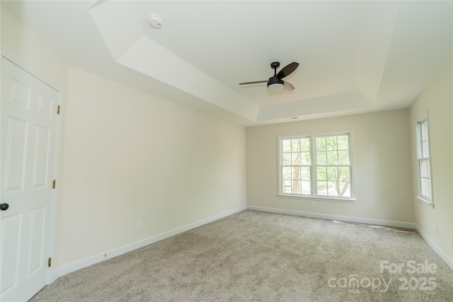 4410 Laurel Twig Ct, Charlotte, NC 28215 - unfurnished room featuring carpet, ceiling fan, a healthy amount of sunlight, and a tray ceiling
