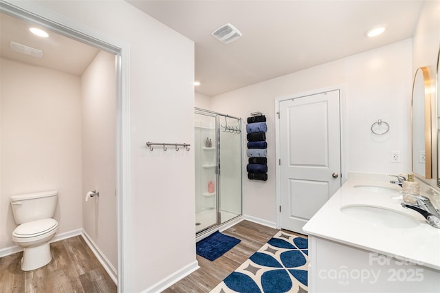 2886 Sherrills Stream Dr, Sherrills Ford, NC 28673 - full bath with a sink, a shower stall, toilet, visible vents, and wood finished floors