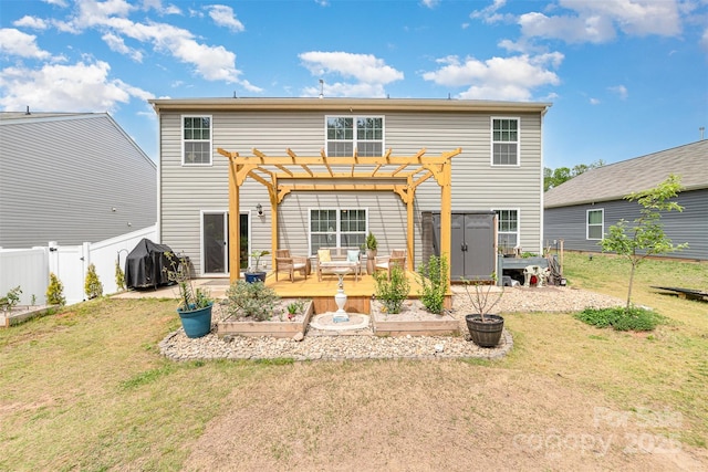 2886 Sherrills Stream Dr, Sherrills Ford, NC 28673 - rear view of house with an outdoor structure, a fenced backyard, a garden, a storage shed, and a lawn
