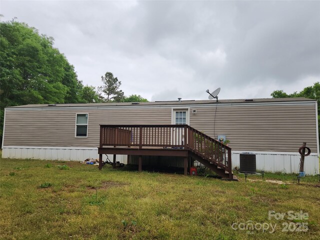 544 Bentley Rd, Shelby, NC 28152 - rear view of property with central air condition unit, a deck, and a lawn