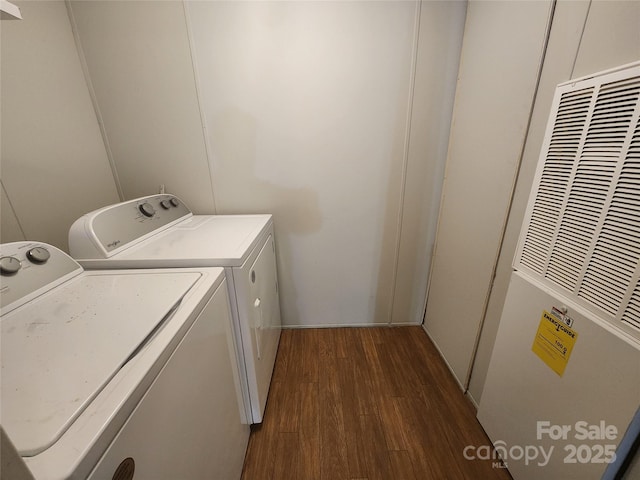 544 Bentley Rd, Shelby, NC 28152 - washroom featuring separate washer and dryer, a heating unit, dark wood-type flooring, and laundry area
