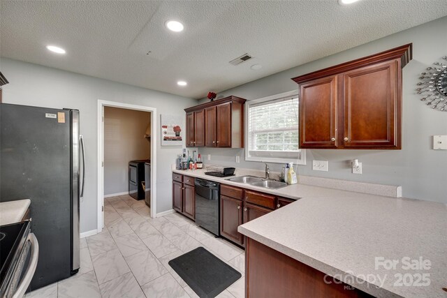 kitchen with marble finish floor, visible vents, a sink, light countertops, and appliances with stainless steel finishes