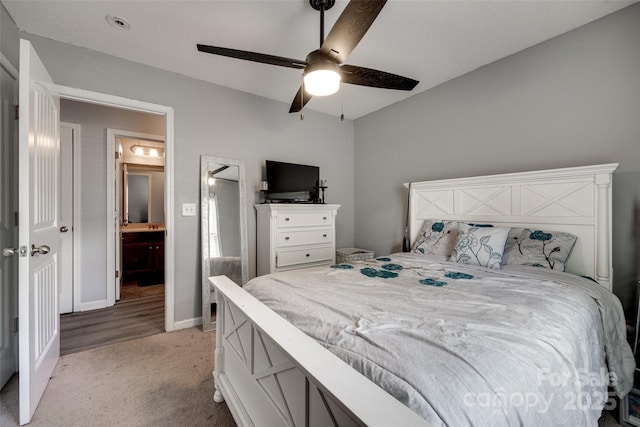 bedroom featuring baseboards, light carpet, and ceiling fan