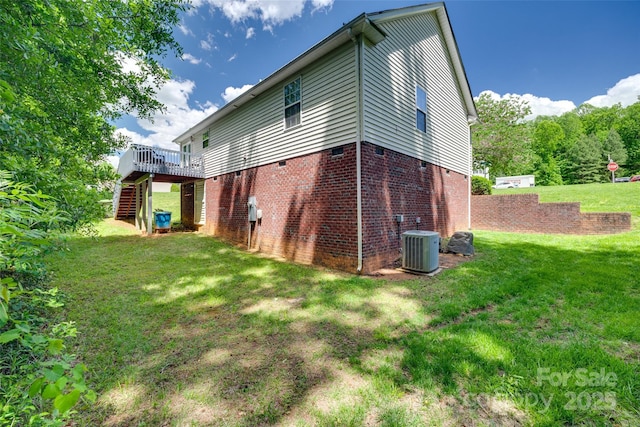 back of property featuring a lawn, cooling unit, stairs, crawl space, and a deck