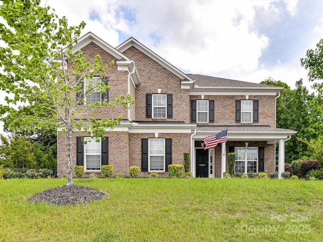 2369 Baxter Pl SE, Concord, NC 28025 - traditional home with brick siding and a front lawn