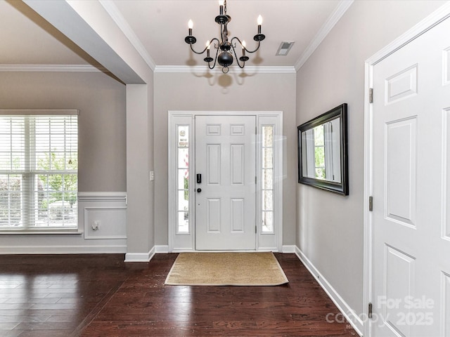 2369 Baxter Pl SE, Concord, NC 28025 - foyer with visible vents, ornamental molding, a notable chandelier, and dark wood-type flooring