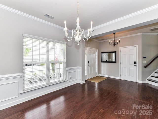 2369 Baxter Pl SE, Concord, NC 28025 - foyer entrance featuring visible vents, hardwood / wood-style flooring, an inviting chandelier, and stairway