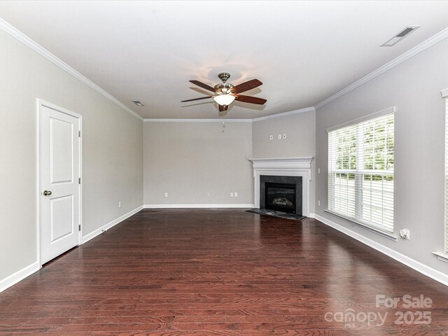 2369 Baxter Pl SE, Concord, NC 28025 - unfurnished living room featuring baseboards, a glass covered fireplace, dark wood-style floors, a ceiling fan, and crown molding