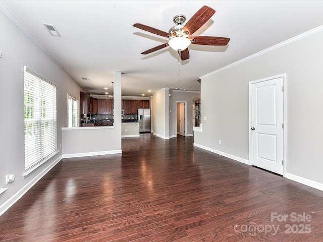 2369 Baxter Pl SE, Concord, NC 28025 - unfurnished living room featuring ornamental molding, a ceiling fan, visible vents, and dark wood-type flooring