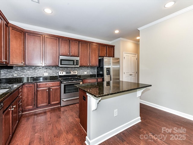 2369 Baxter Pl SE, Concord, NC 28025 - kitchen with baseboards, tasteful backsplash, stainless steel appliances, and ornamental molding