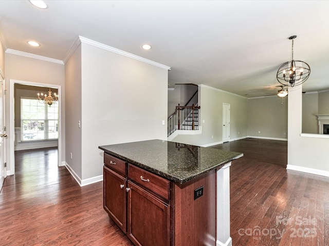 2369 Baxter Pl SE, Concord, NC 28025 - kitchen featuring crown molding, a center island, recessed lighting, dark wood-type flooring, and ceiling fan with notable chandelier