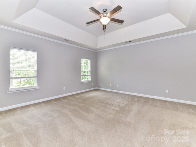 2369 Baxter Pl SE, Concord, NC 28025 - unfurnished room with baseboards, a tray ceiling, a ceiling fan, and carpet floors
