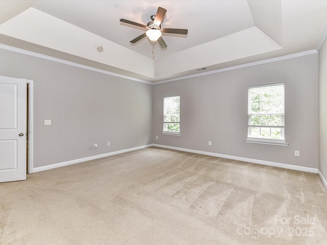 2369 Baxter Pl SE, Concord, NC 28025 - empty room featuring baseboards, a raised ceiling, ceiling fan, and light colored carpet