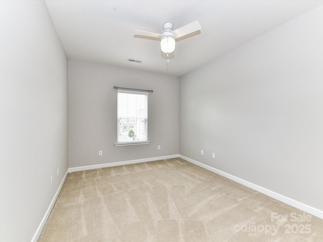 2369 Baxter Pl SE, Concord, NC 28025 - unfurnished room with baseboards, visible vents, a ceiling fan, and light carpet