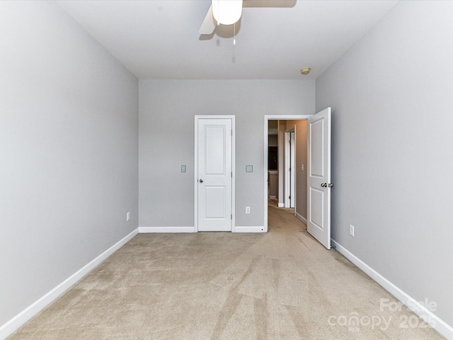2369 Baxter Pl SE, Concord, NC 28025 - unfurnished bedroom featuring carpet, a ceiling fan, and baseboards