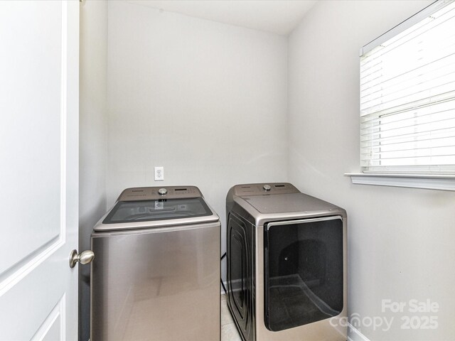 2369 Baxter Pl SE, Concord, NC 28025 - clothes washing area with washer and clothes dryer, laundry area, and plenty of natural light