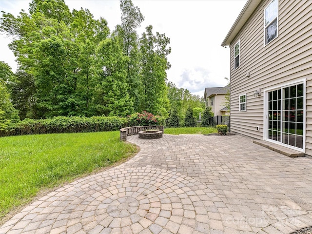 2369 Baxter Pl SE, Concord, NC 28025 - view of patio / terrace with an outdoor fire pit