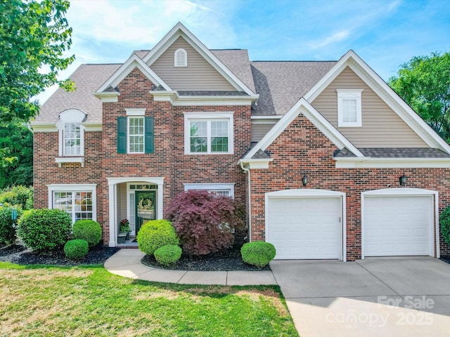 view of front of property featuring brick siding, an attached garage, driveway, and roof with shingles