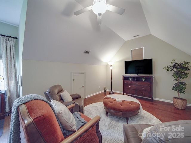 living area featuring visible vents, a ceiling fan, wood finished floors, and vaulted ceiling