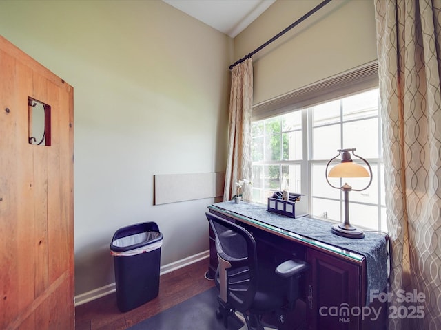 office space featuring baseboards and wood finished floors