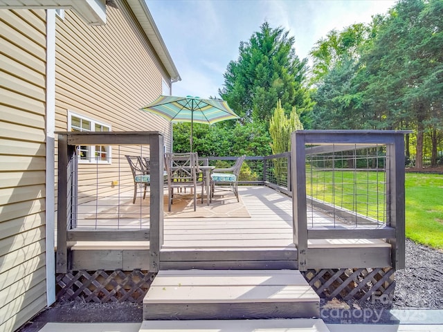 deck featuring outdoor dining space