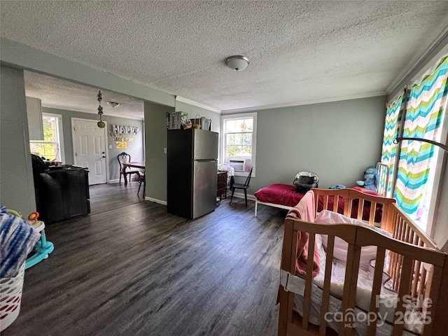 336 Hamilton Dr NE, Concord, NC 28025 - bedroom featuring crown molding, cooling unit, a textured ceiling, dark wood finished floors, and freestanding refrigerator