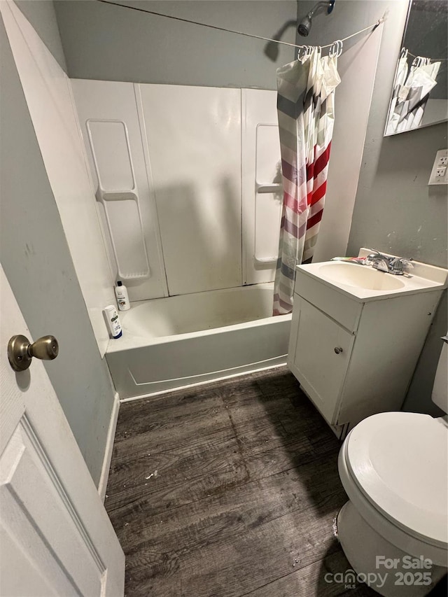 336 Hamilton Dr NE, Concord, NC 28025 - bathroom featuring vanity, toilet, wood finished floors, and shower / tub combo