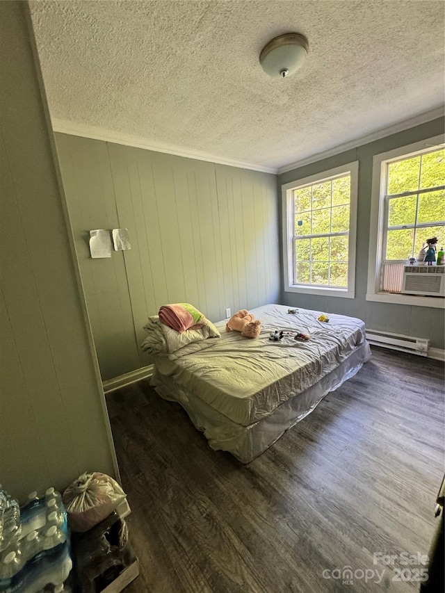 336 Hamilton Dr NE, Concord, NC 28025 - bedroom featuring crown molding, wood finished floors, a textured ceiling, cooling unit, and a baseboard radiator