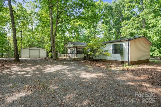 351 Fletcher Rd, Union Grove, NC 28689 - view of front of home with covered porch, driveway, an outdoor structure, and a garage