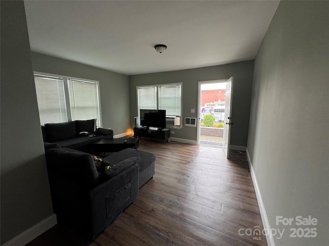 81 Academy Ave NW, Concord, NC 28025 - living area featuring dark wood finished floors and baseboards