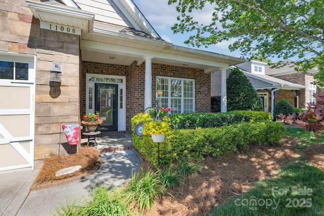 11008 Round Rock Rd, Charlotte, NC 28277 - view of exterior entry featuring covered porch and brick siding