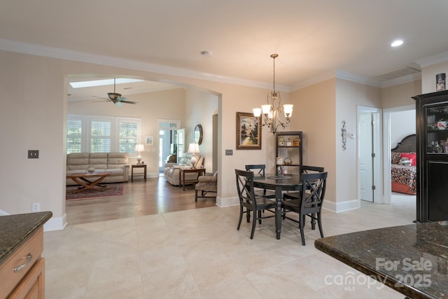 11008 Round Rock Rd, Charlotte, NC 28277 - dining space with ornamental molding, baseboards, recessed lighting, arched walkways, and ceiling fan with notable chandelier