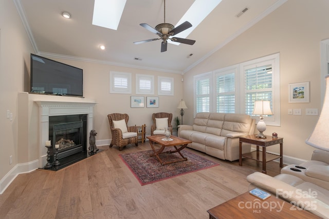 11008 Round Rock Rd, Charlotte, NC 28277 - living area with crown molding, baseboards, lofted ceiling with skylight, and a healthy amount of sunlight